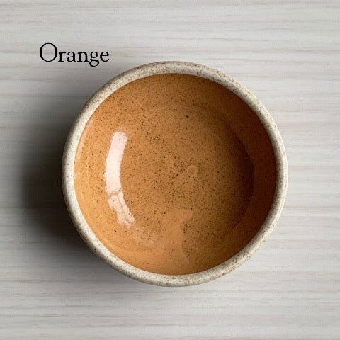 handmade Japanese ceramic round mini condiment dishes in orange