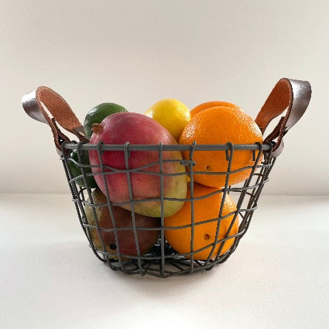 woven iron metal round fruit basket with cognac brown leather handles