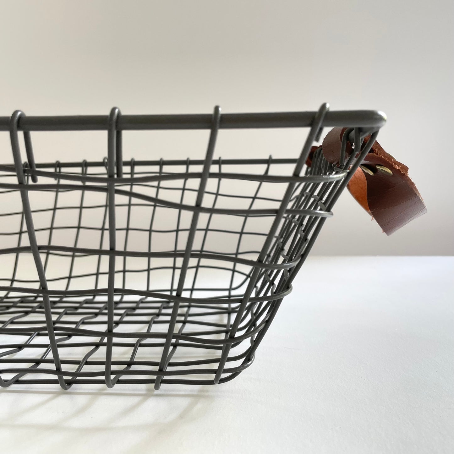 woven rectangular iron fruit basket with leather handles