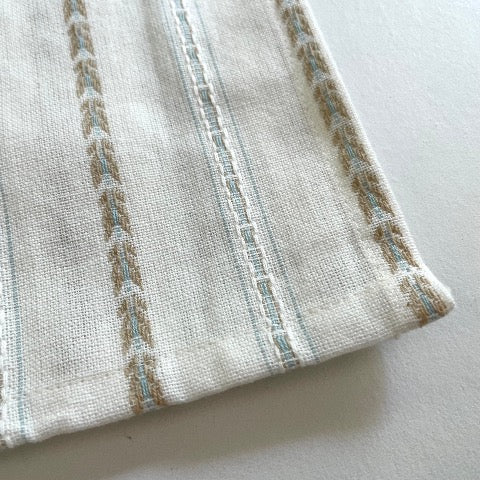 100 percent cotton cream 18x18 table dinner napkins with tan and blue pattern
