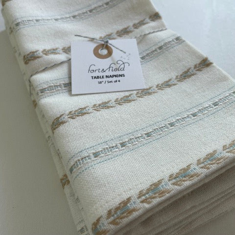 100 percent cotton cream 18x18 table dinner napkins with tan and blue pattern