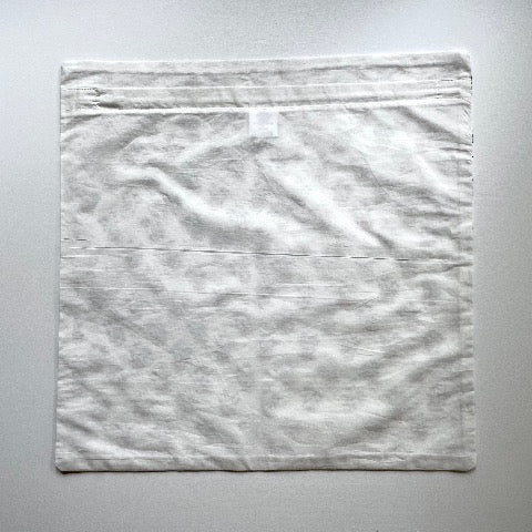 neutral peach and greenish grey floral buds block printed 100 percent cotton 18x18 square pillow cover