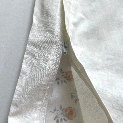 neutral peach and greenish grey floral buds block printed 100 percent cotton 18x18 square pillow cover