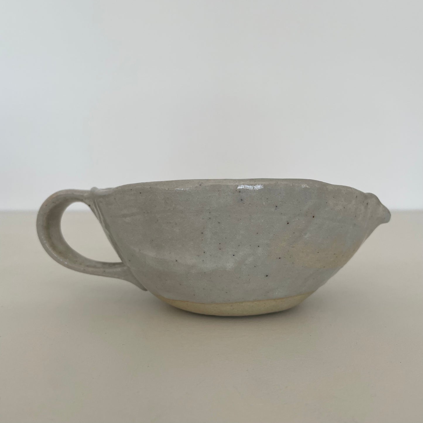 cream and grey gohonte handmade Japanese ceramic pottery small round pitcher, syrup pourer, gravy boat