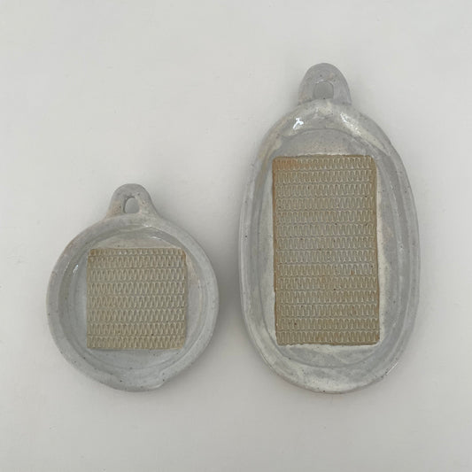 neutral grey and cream gohonte handmade ceramic pottery Japanese round and oval food graters with handle