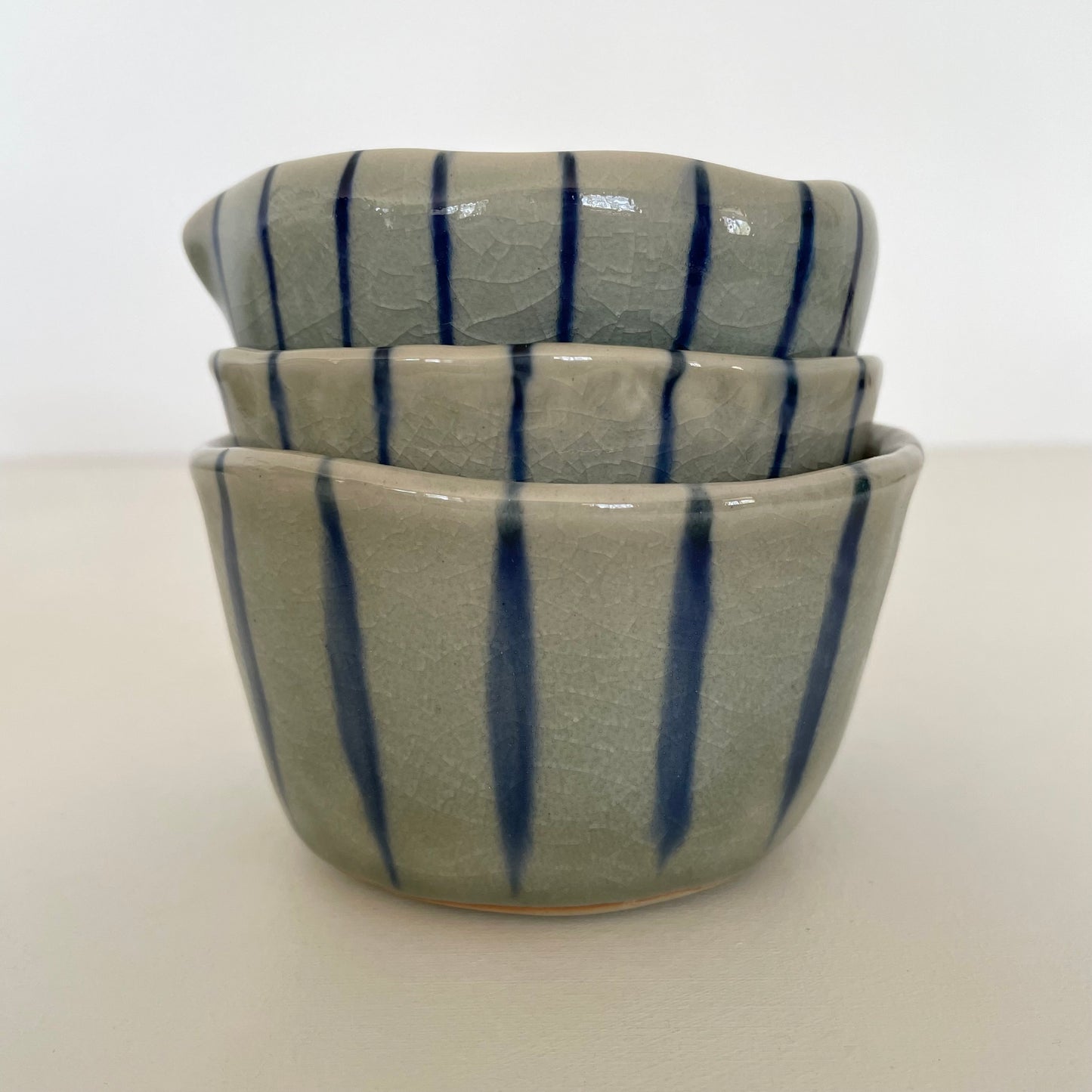 blue stripe handmade Japanese bowl, pitcher, and cup