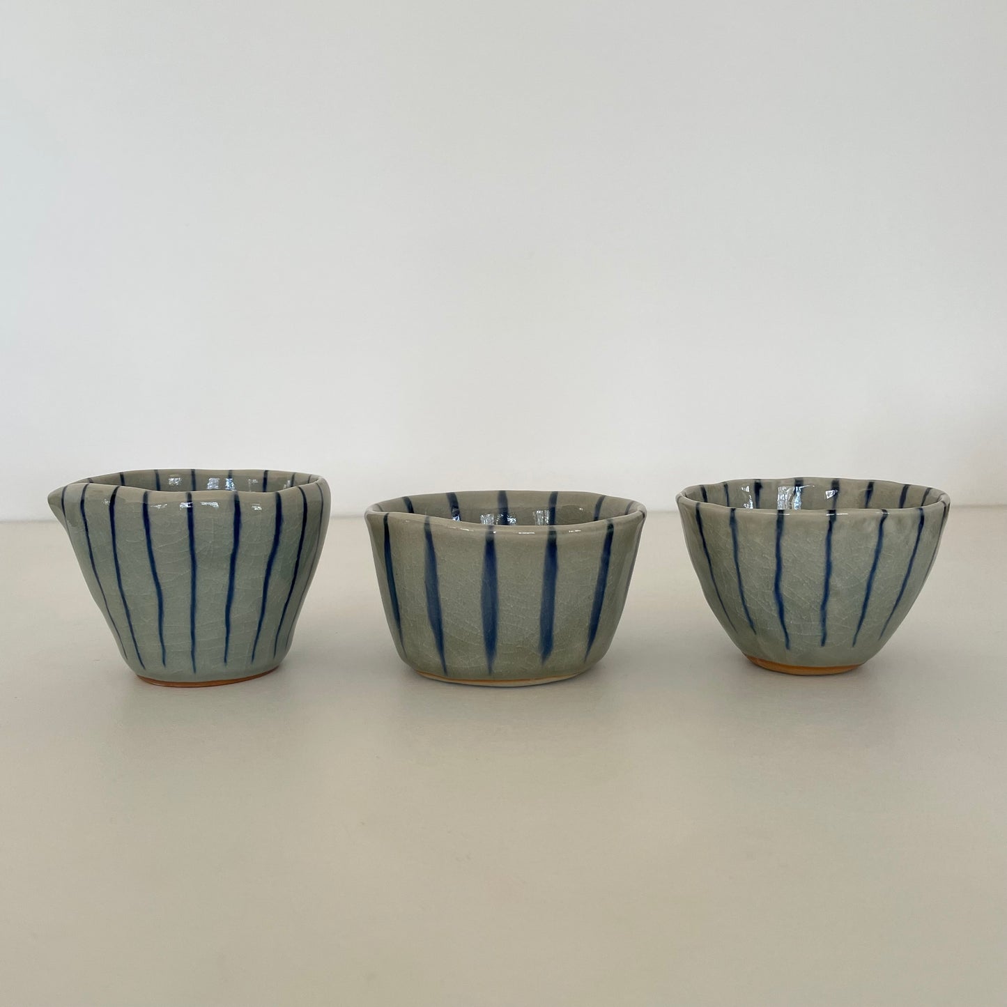 blue stripe handmade Japanese bowl, pitcher, and cup