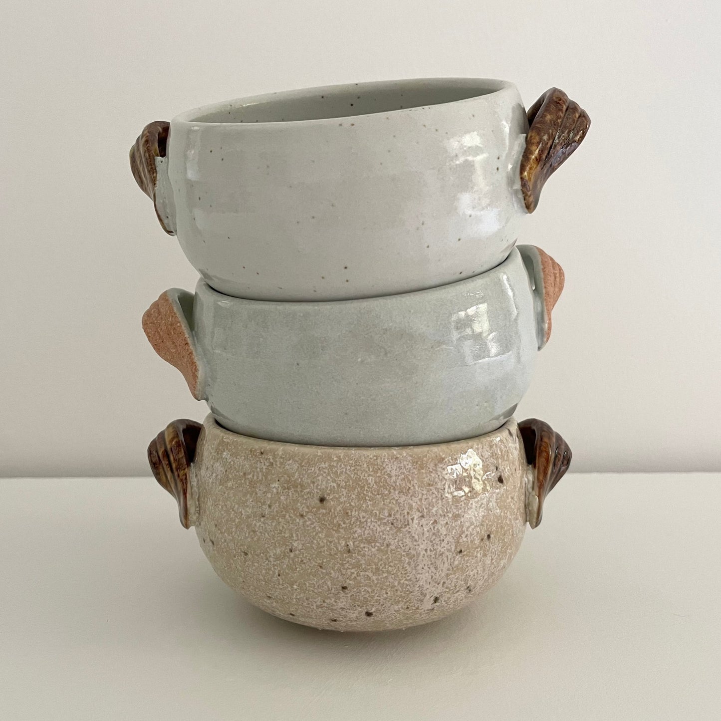 handmade Japanese pottery neutral white tan and light blue soup bowls with handles