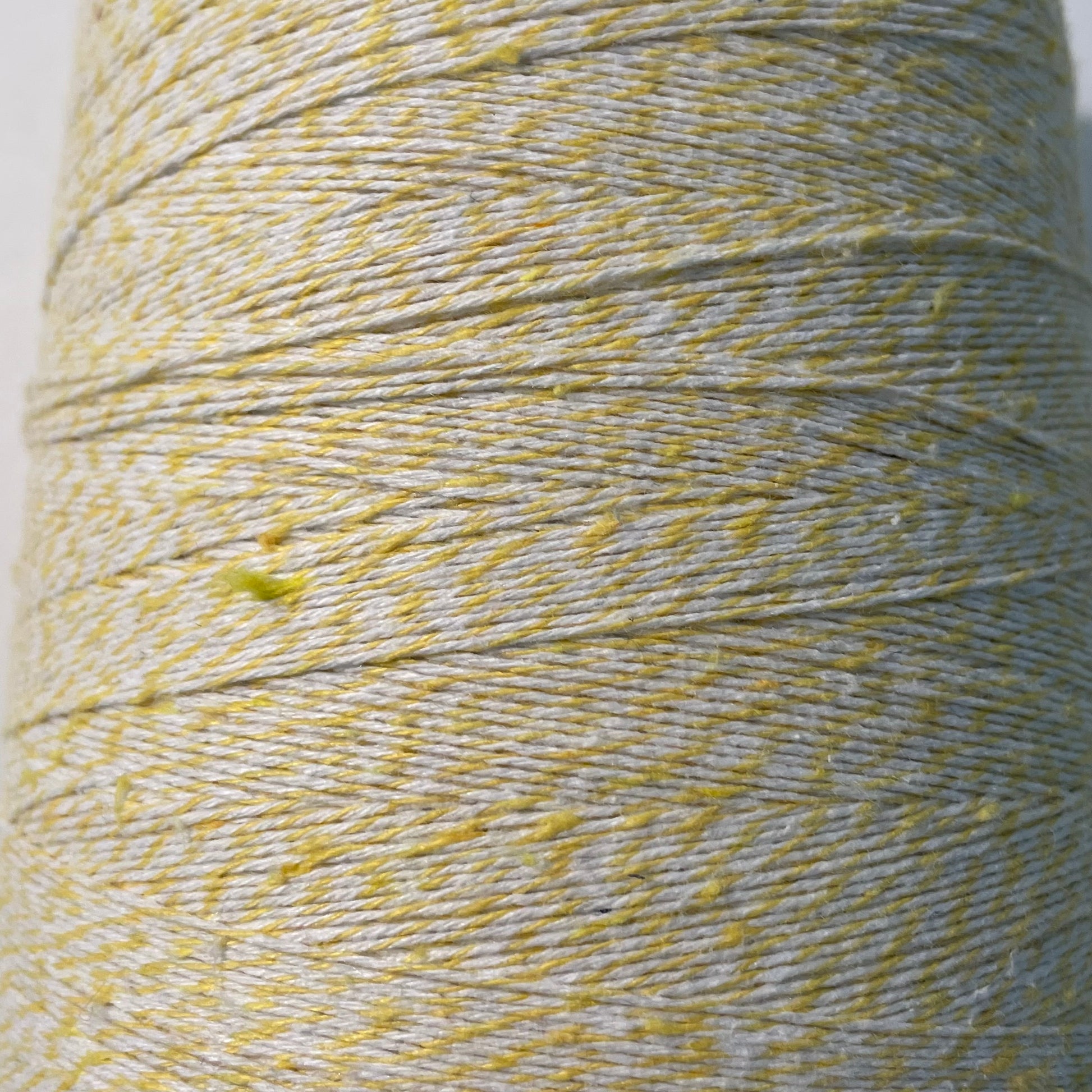 yellow and white striped bakers twine bulk 2 pound cone for crafts and packaging detail showing tufts in the fiber