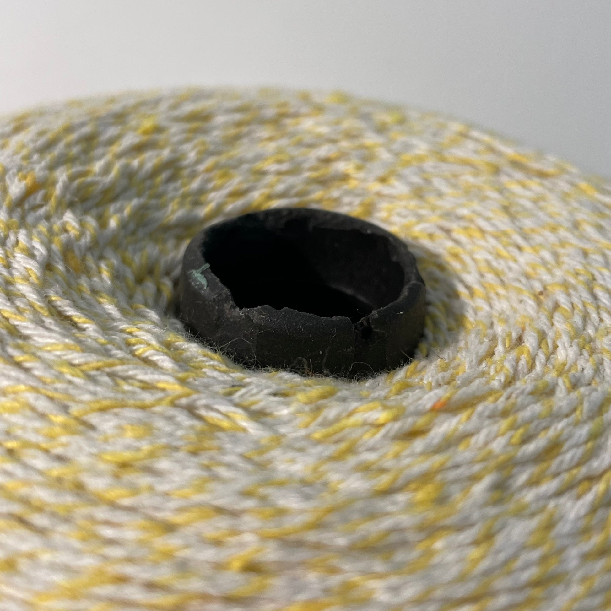yellow and white striped bakers twine bulk 2 pound cone for crafts and packaging detail showing chips in the cone
