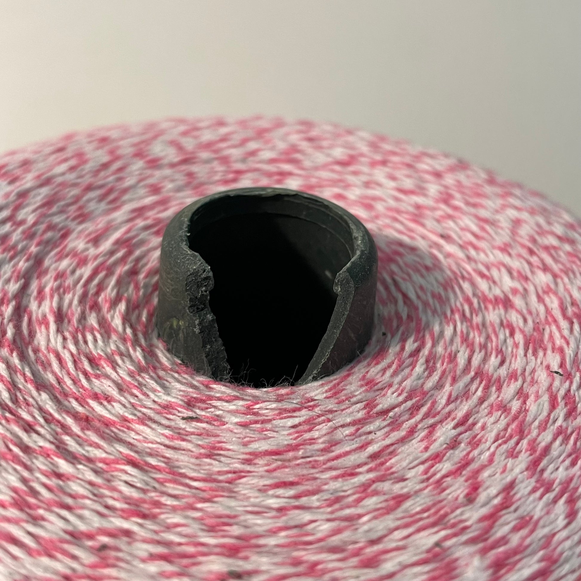 hot pink and white striped bakers twine bulk 2 pound cone for crafts and packaging closeup showing breaks on plastic cone