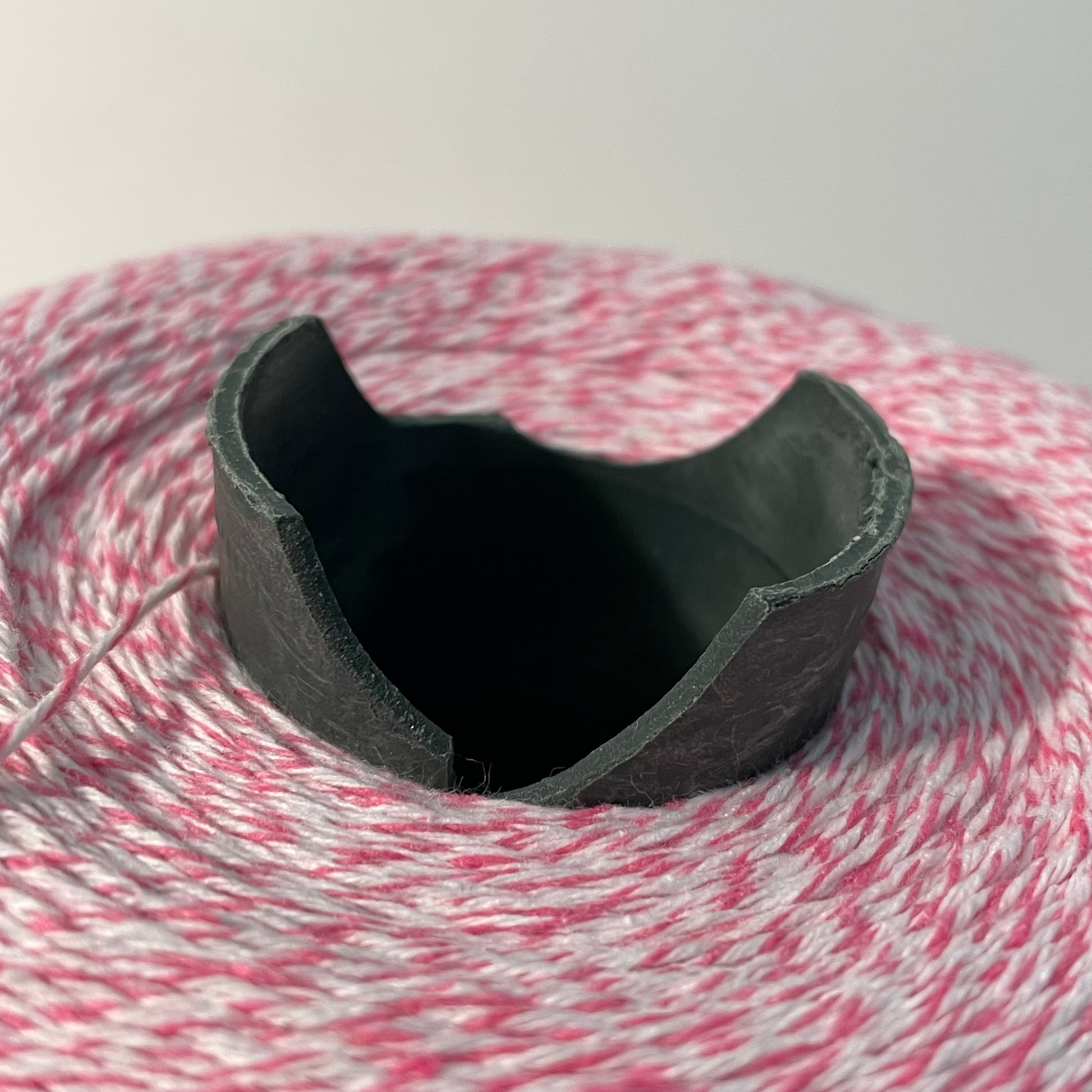 hot pink and white striped bakers twine bulk 2 pound cone for crafts and packaging closeup showing breaks on plastic cone