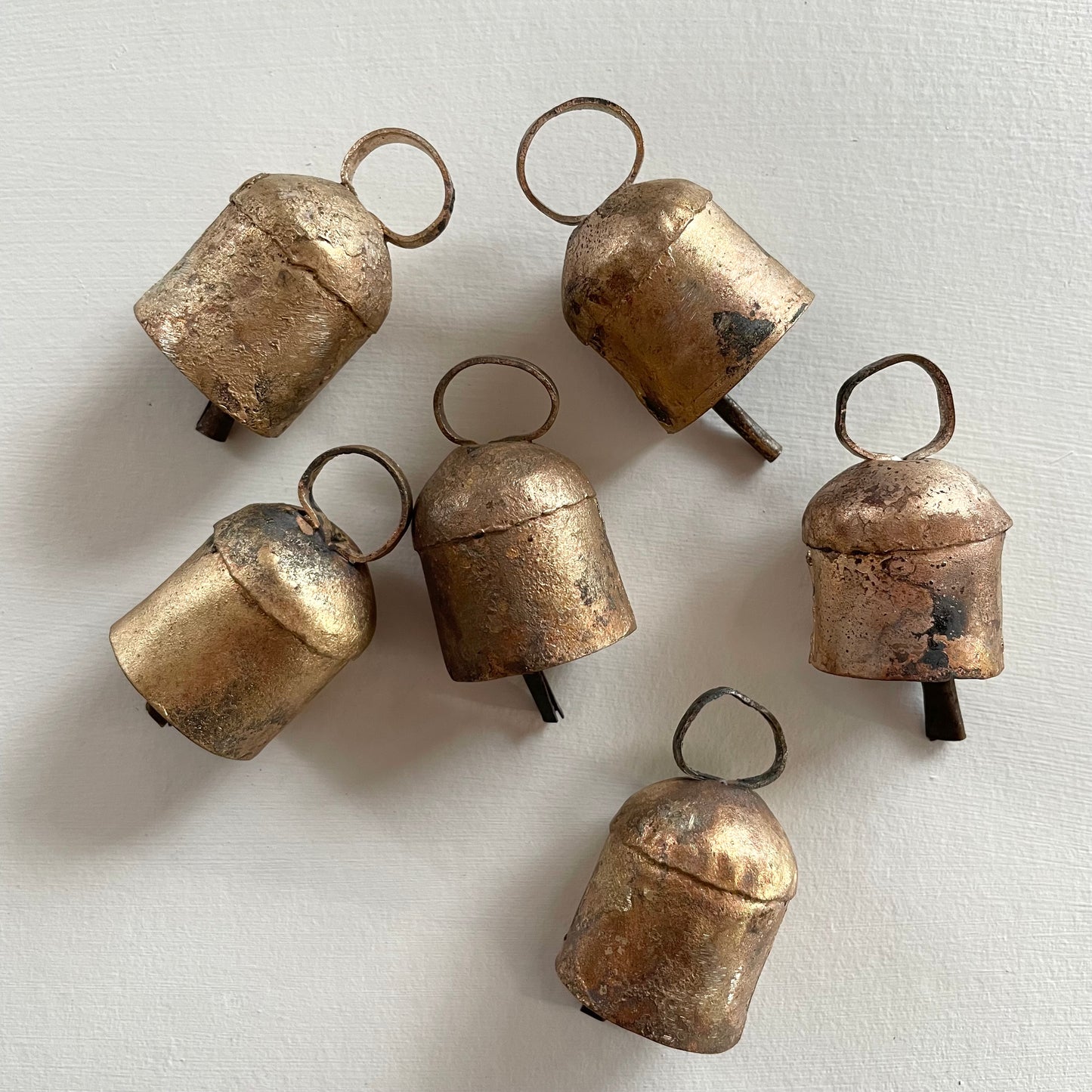 rounded top rustic tin bell with brass finish for an old world holiday decor