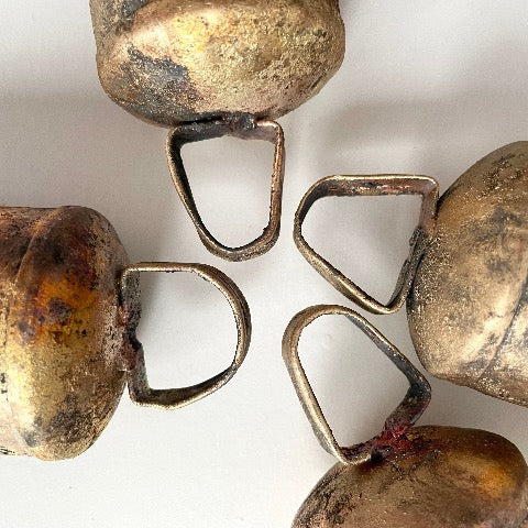 photo showing the difference in the shape of the handles on the 5 1/2 inch flat top bell