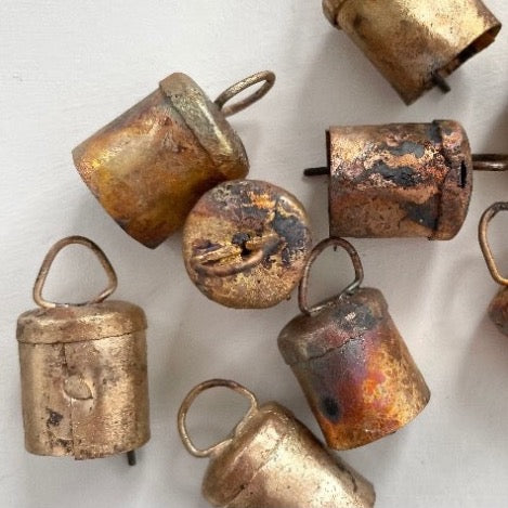 1 1/2 inch tiny flat top tin bells with brass finish and a metal striker