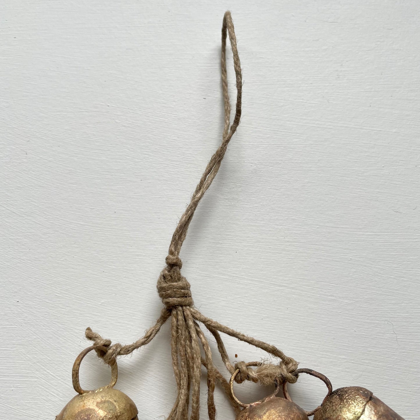 hanging rustic bell garland with 12 cow bells on jute for holiday or garden