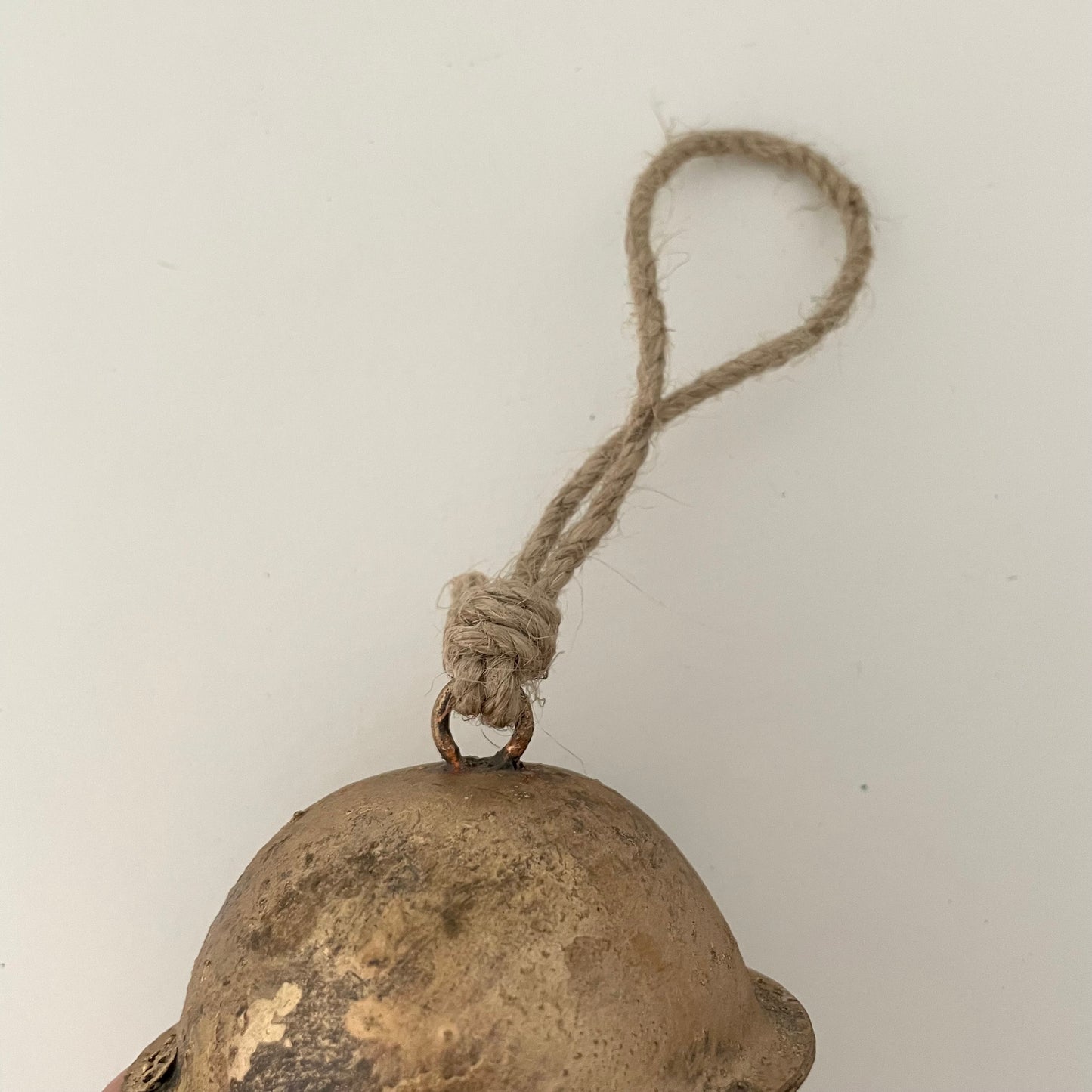 3" rustic cross-cut tin sleigh bell with brass finish and jute hanger