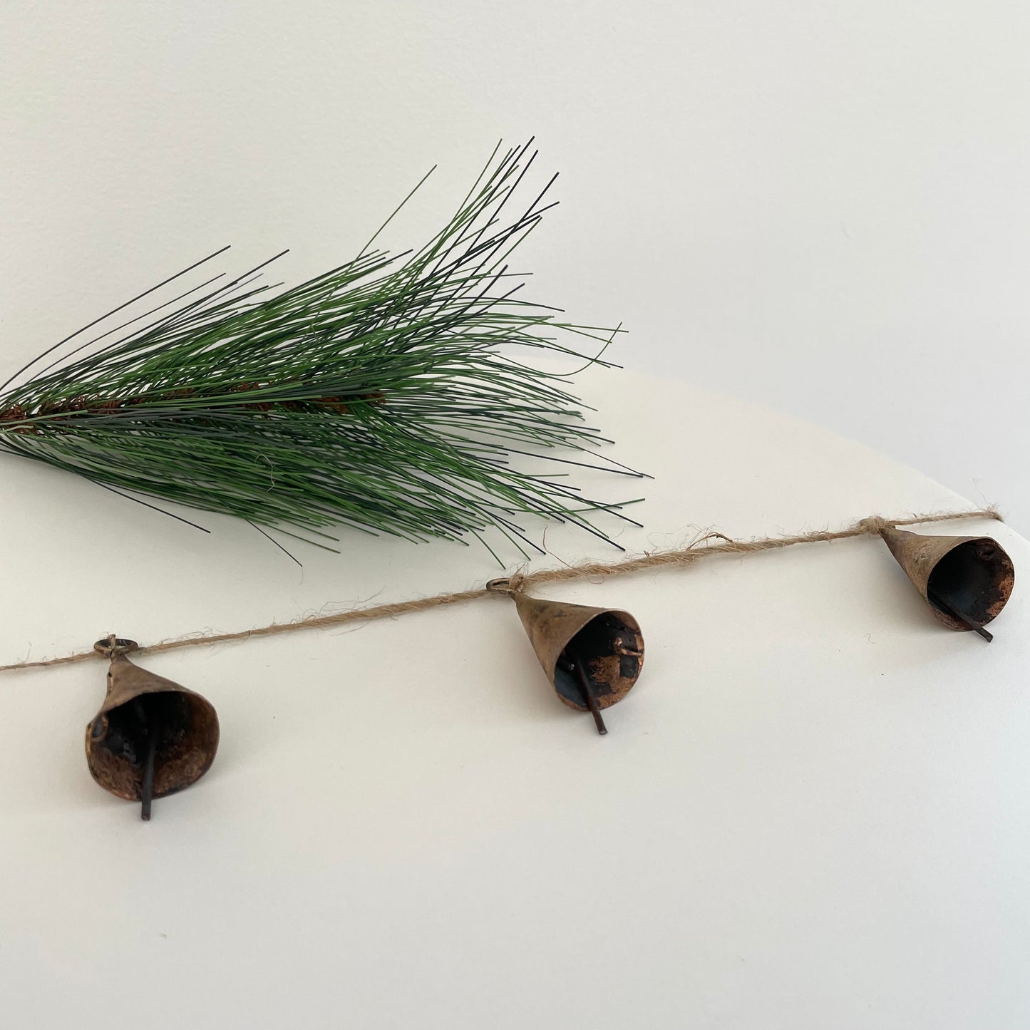 tin cone bell with brass finish on 72 inch jute garland