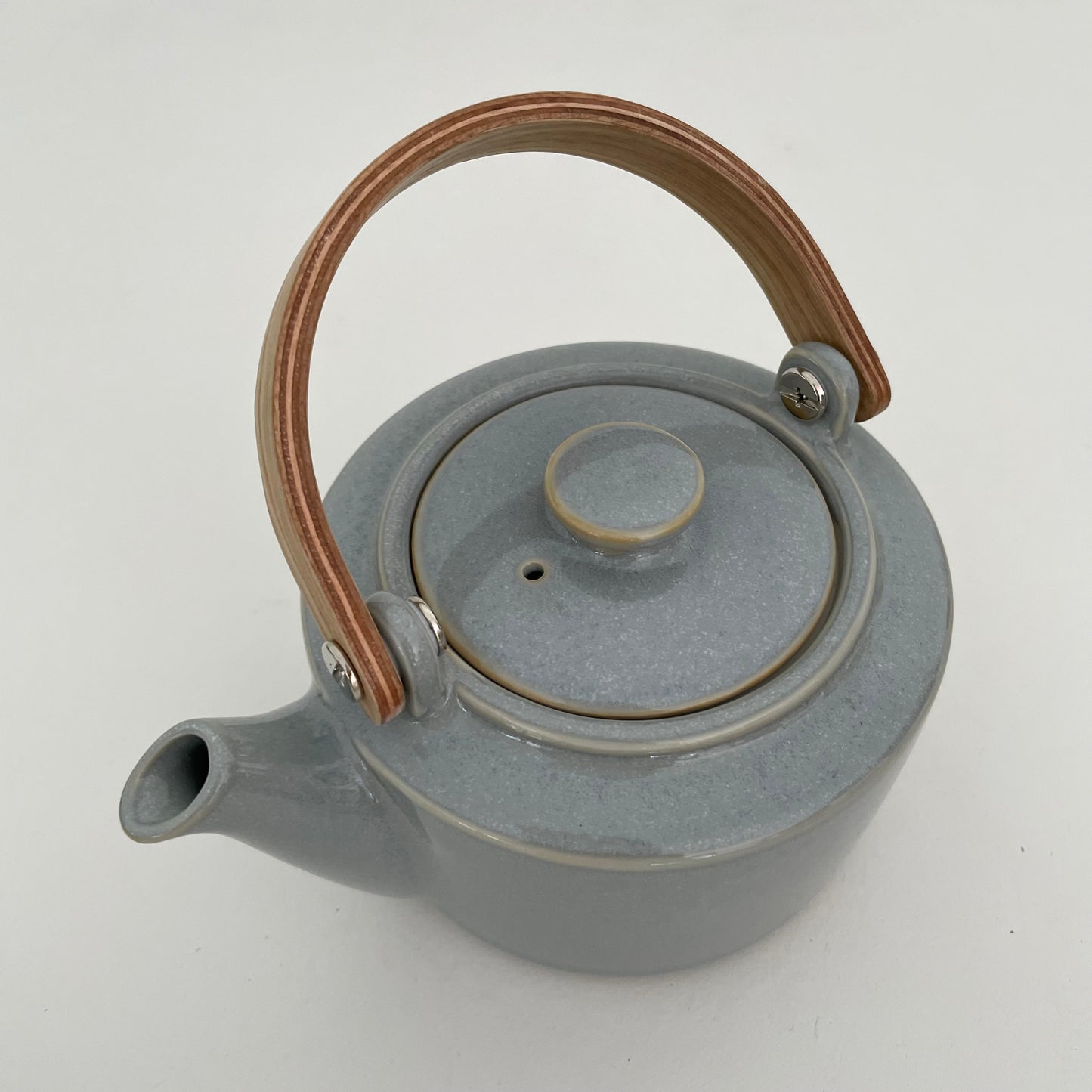 grayish blue handmade ceramic Japanese 1-2 cup teapot with bent wood handle and metal strainer