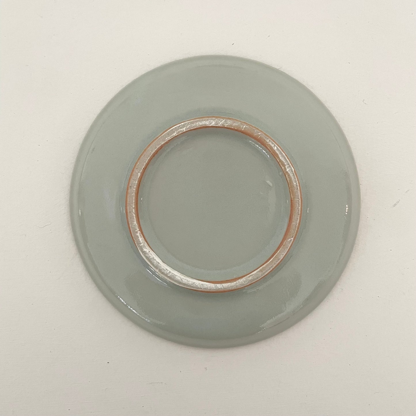 blue round ceramic handmade Japanese dish with etched lines and dots