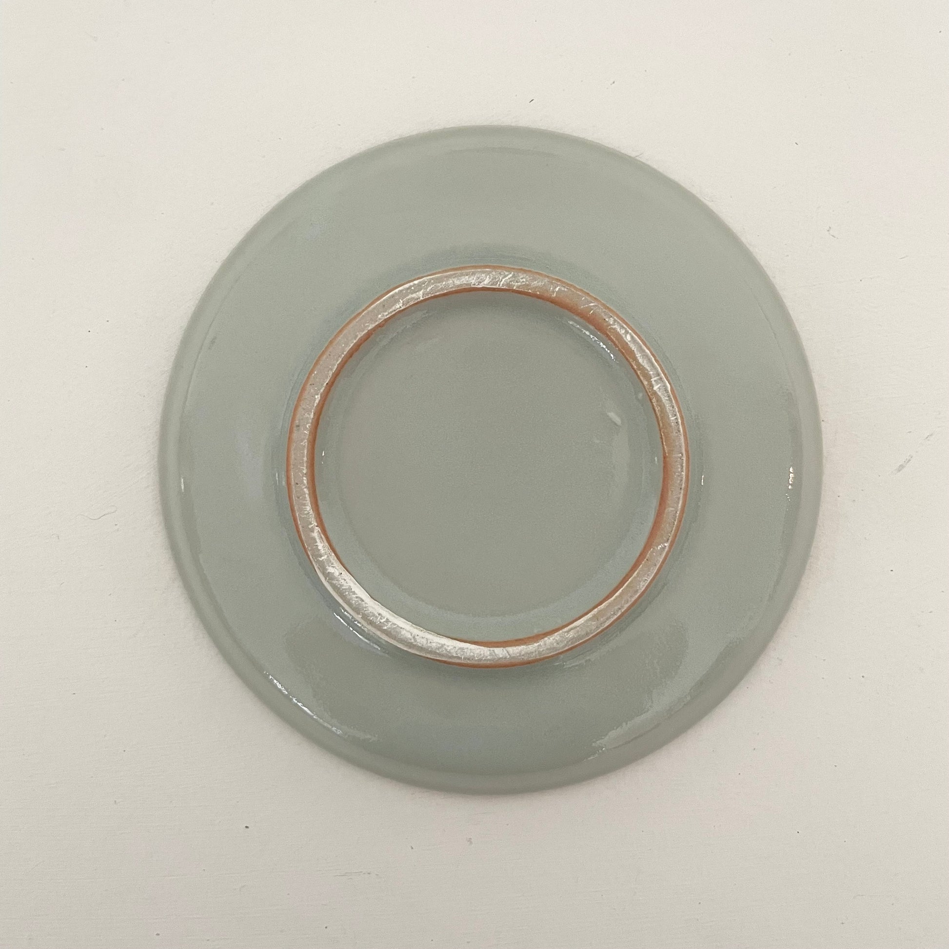 blue round ceramic handmade Japanese dish with etched lines and dots