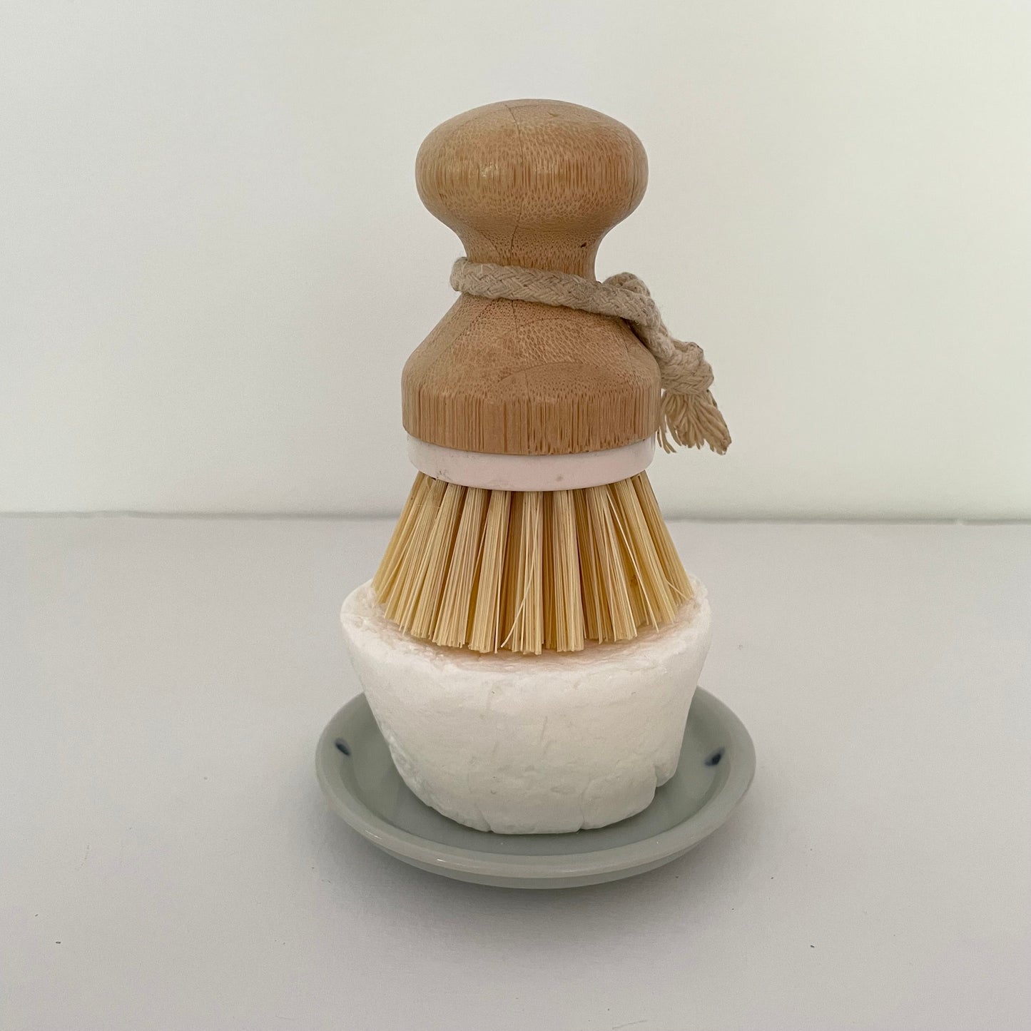 blue round ceramic handmade Japanese dish with etched lines and dots to use for a kitchen eco dish block