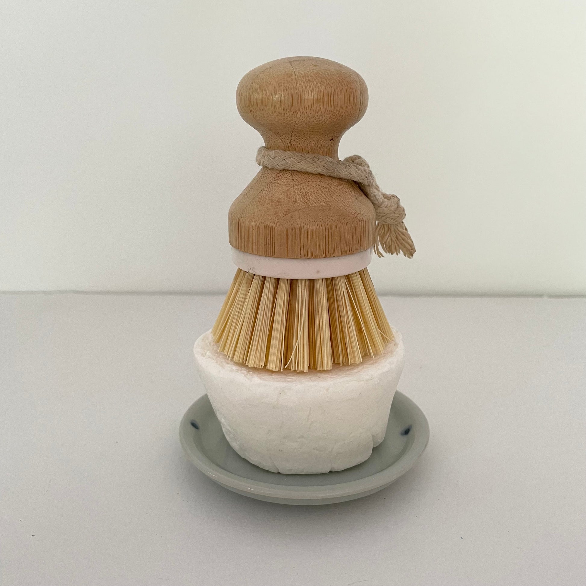 blue round ceramic handmade Japanese dish with etched lines and dots to use for a kitchen eco dish block