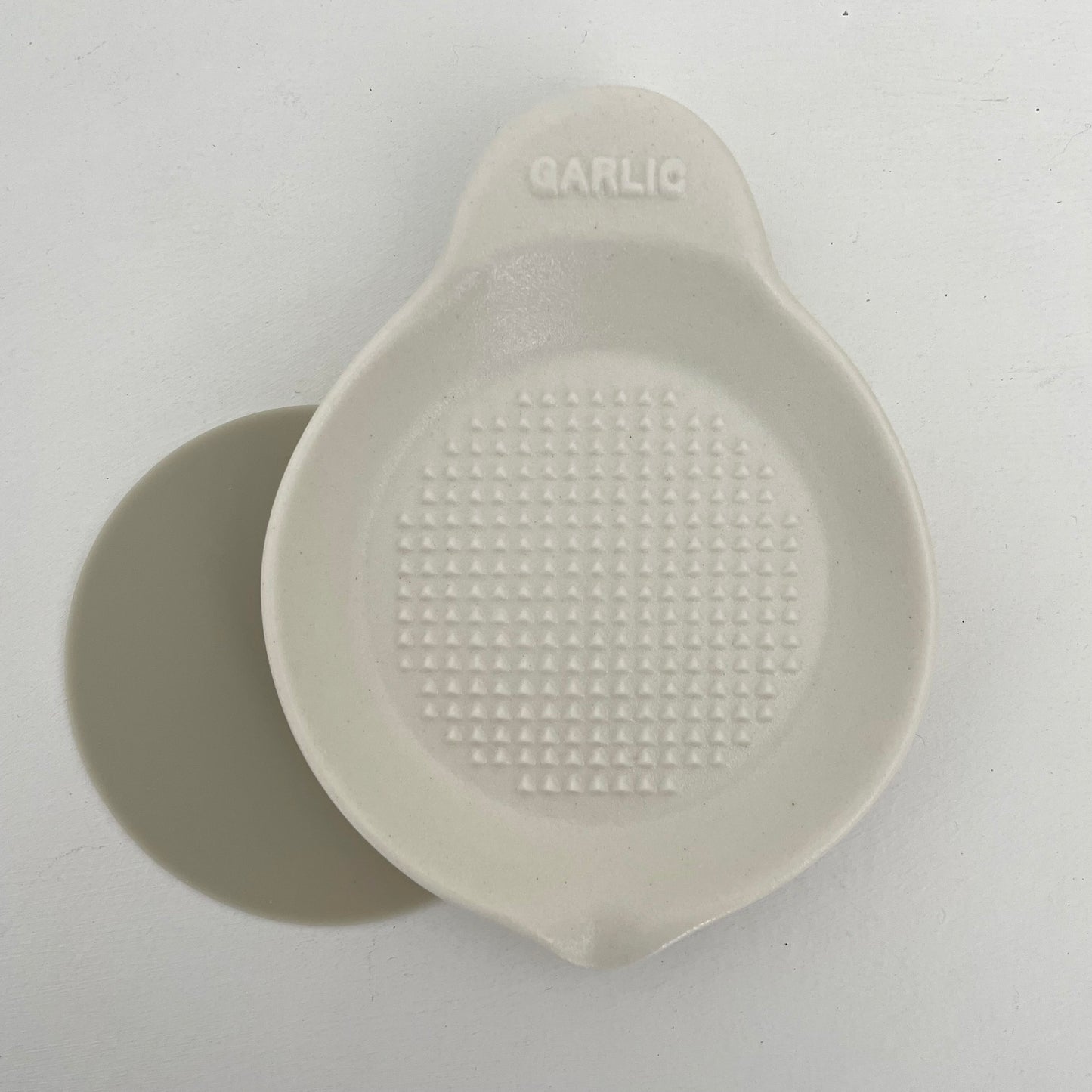 stack of handmade Japanese white ceramic garlic grater