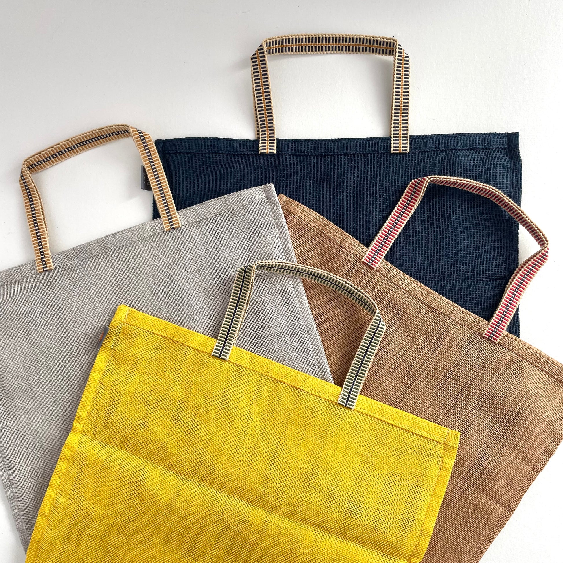 large 100 percent cotton mesh mosquito net eco produce bags with handle in grey, yellow, brown, and navy blue