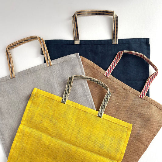 large 100 percent cotton mesh mosquito net eco produce bags with handle in grey, yellow, brown, and navy blue