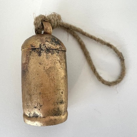4 inch rustic tin bell with brass finish and wood striker for an old world holiday decor