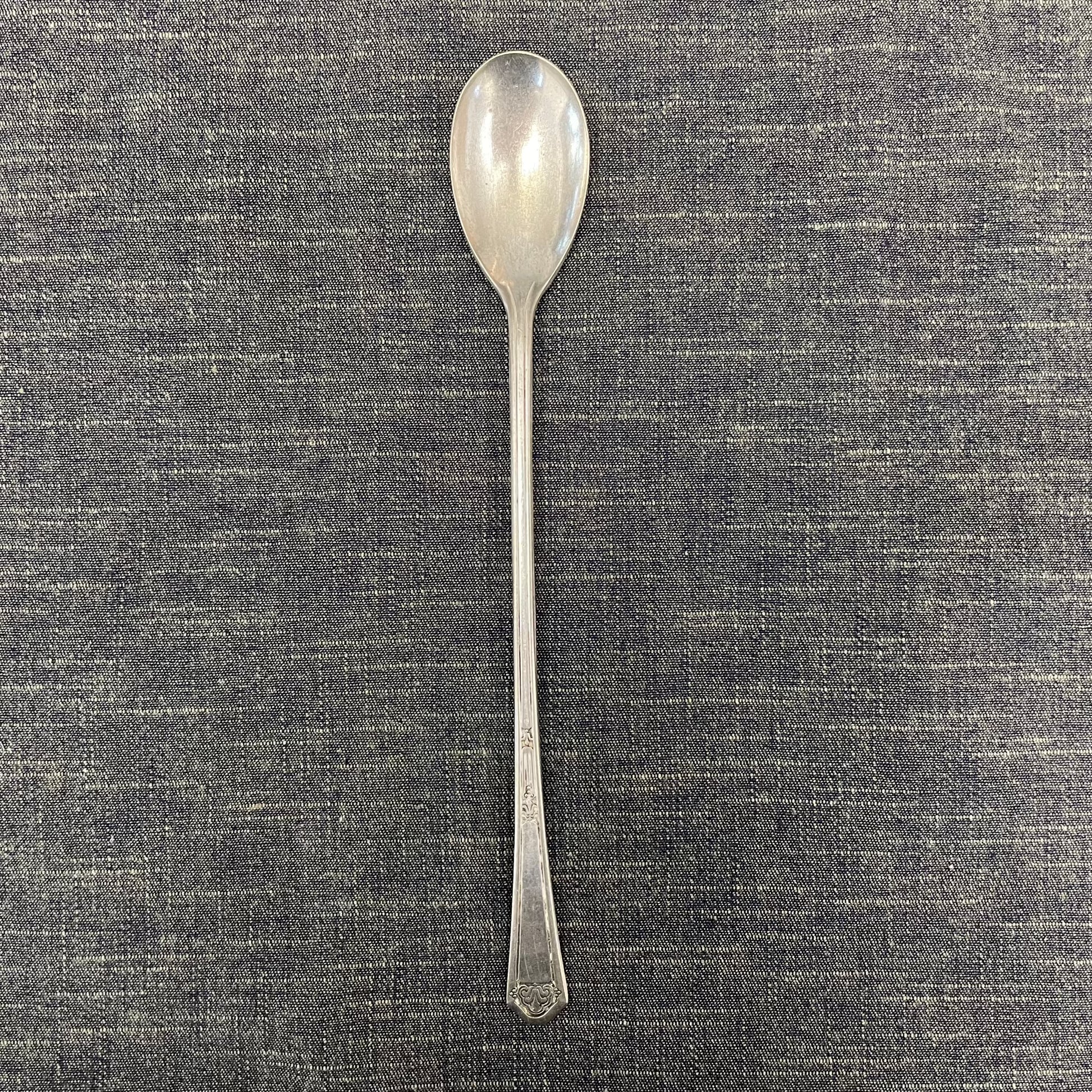 antique silver long handled teaspoon for serving jam or prop photography