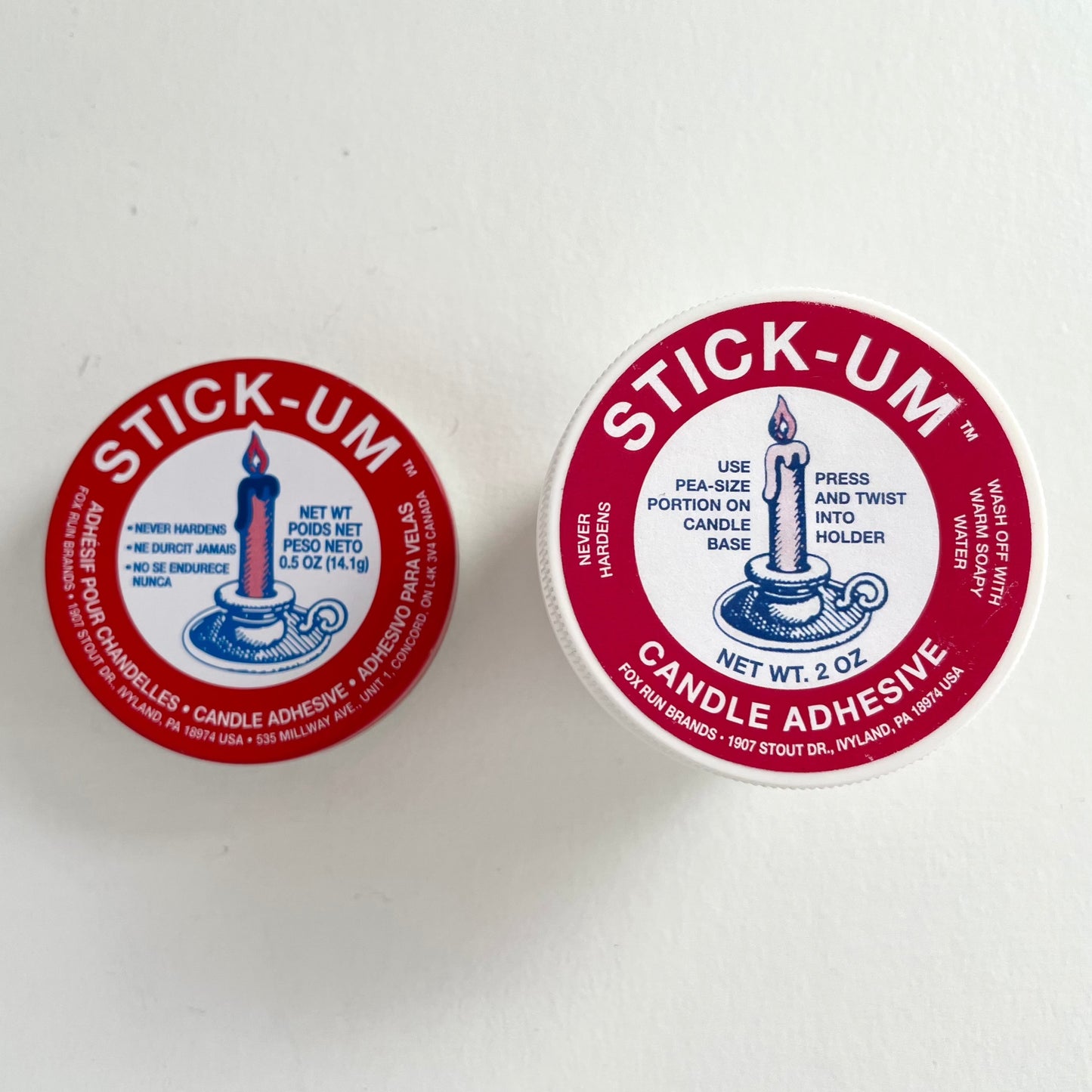 stick-um candle wax adhesive to keep tapers upright in the stand