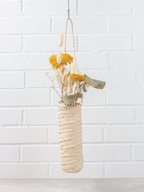slim hanging sustainably harvested palm fiber woven hanging handmade moroccan baskets with dried flowers