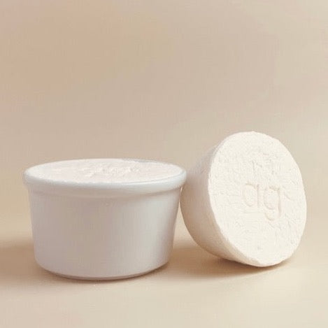 eco and sustainable solid dish soap refill for a farmhouse kitchen in a white porcelain bowl