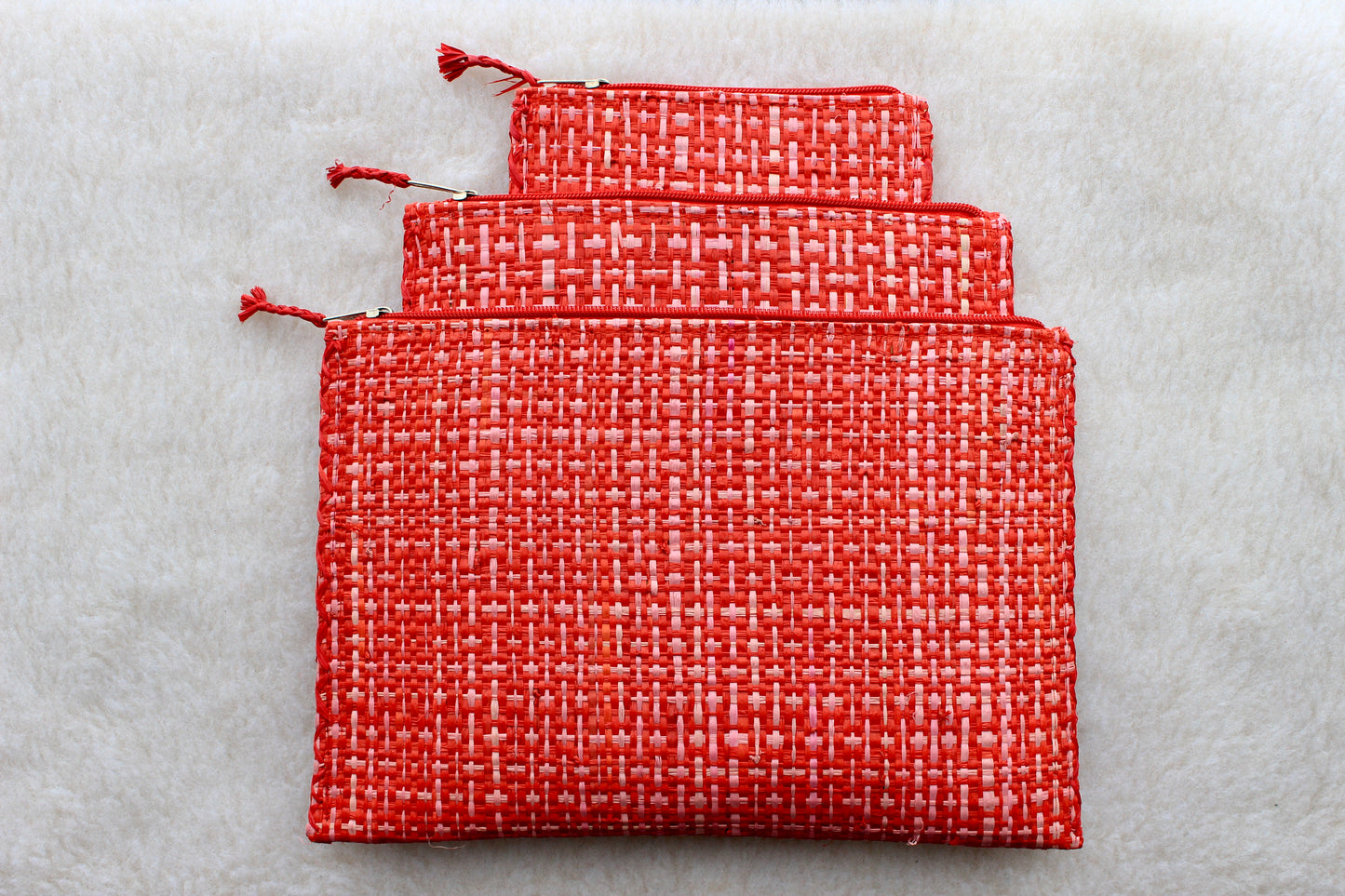 set of 3 hot pink textured raffia woven bohemian zippered pouches