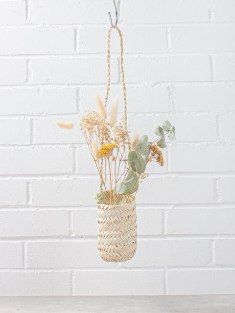 slim hanging sustainably harvested palm fiber woven hanging handmade moroccan baskets with dried flowers