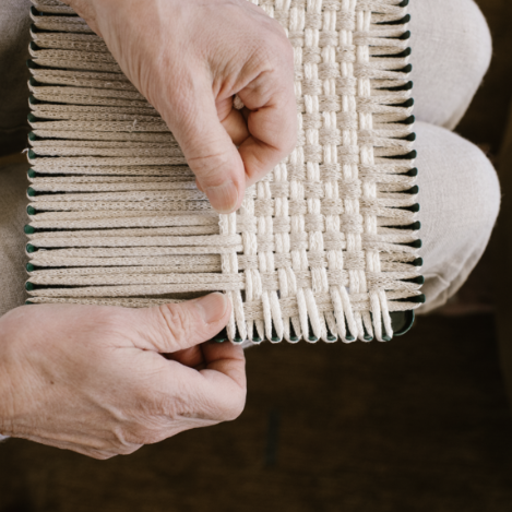 handmade 100 percent cotton bobble woven potholder or trivet on the loom for a farmhouse kitchen