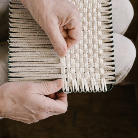handmade 100 percent cotton bobble woven potholder or trivet on the loom for a farmhouse kitchen