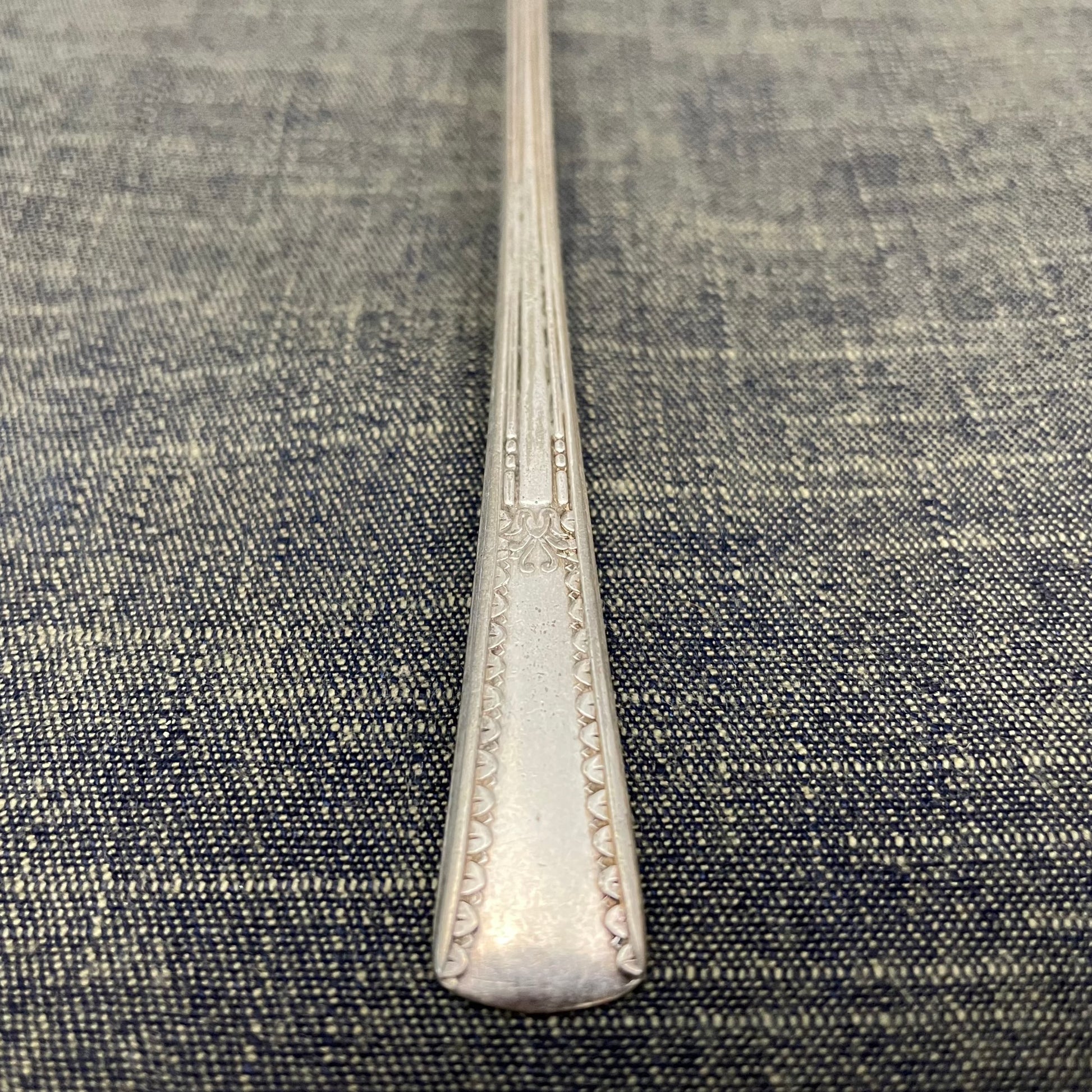 antique silver long handled teaspoon for serving jam or prop photography