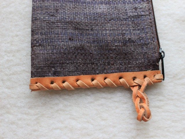 solid indigo blue muted raffia woven zippered clutch with leather trim bohemian