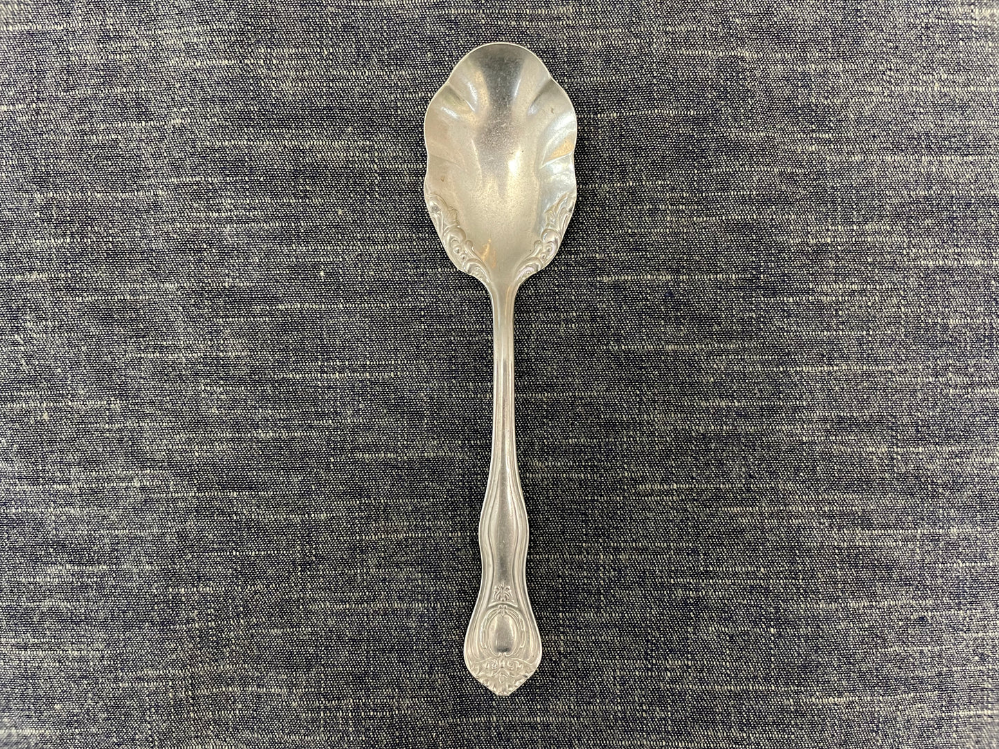 antique silver small serving spoon for serving or prop photography