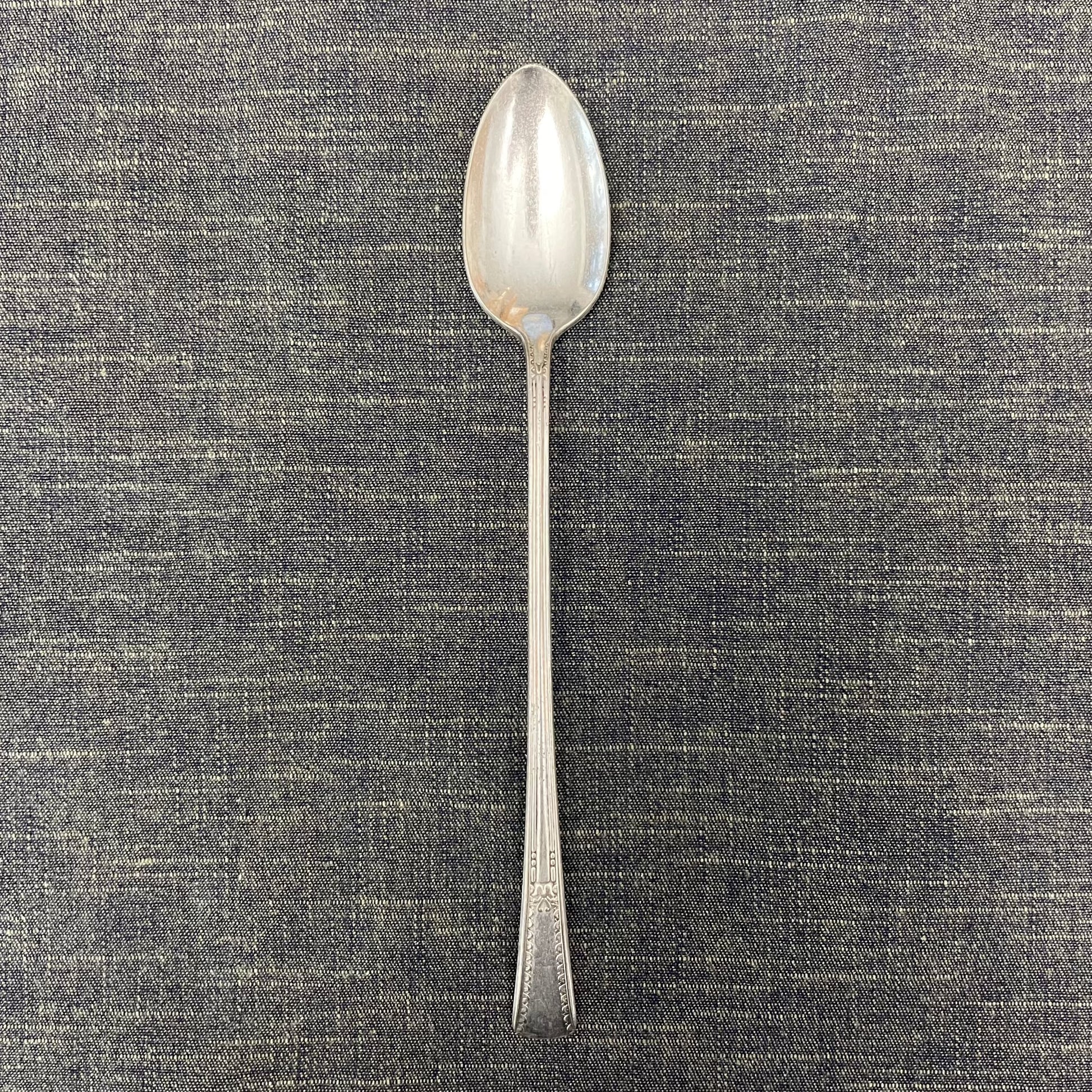 antique silver long handled teaspoon for serving jam or prop photography