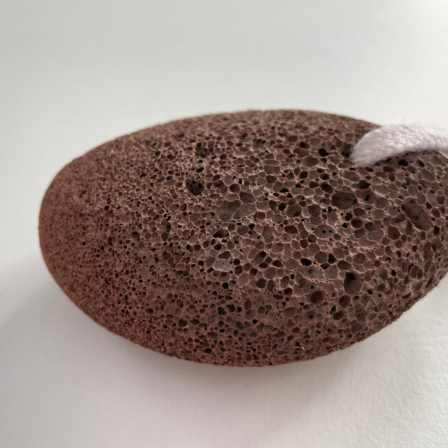 natural lava exfoliating pumice stone on a cotton rope