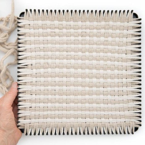 handmade 100 percent cotton bobble woven potholder or trivet on the loom for a farmhouse kitchen