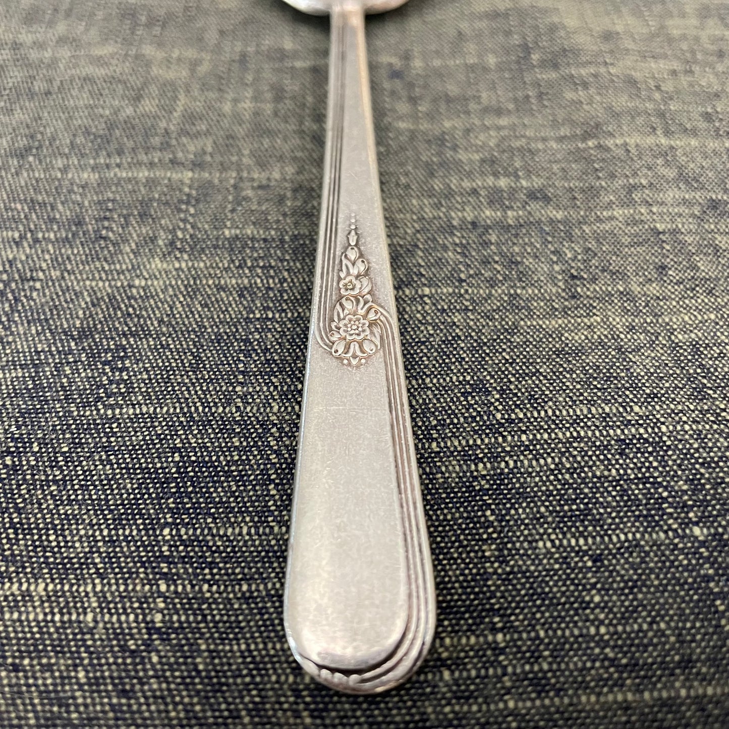 antique silver small serving spoon for serving or prop photography