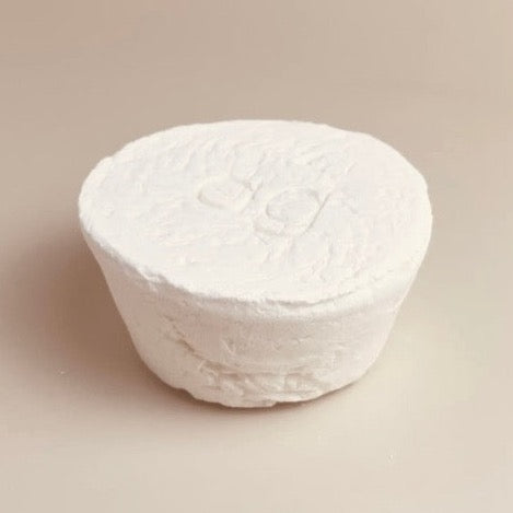 eco and sustainable solid dish soap refill for a farmhouse kitchen in a white porcelain bowl