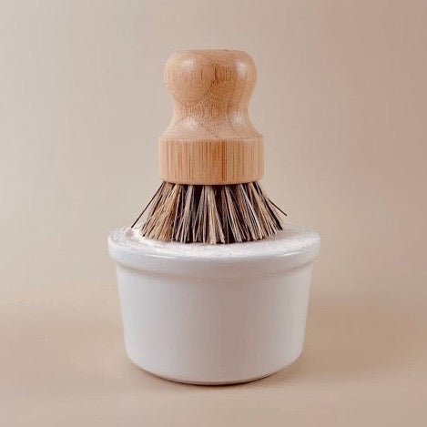 eco and sustainable solid dish soap for a farmhouse kitchen in a white porcelain bowl