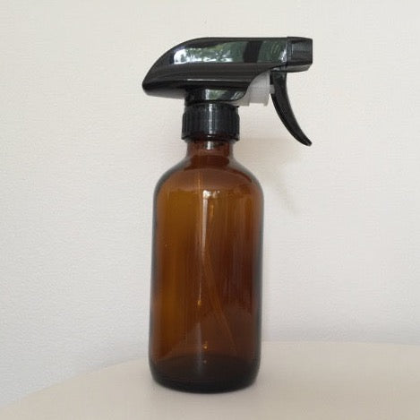 amber glass utilitarian bottle with black spray top in 8 ounce and 16 ounce sizes