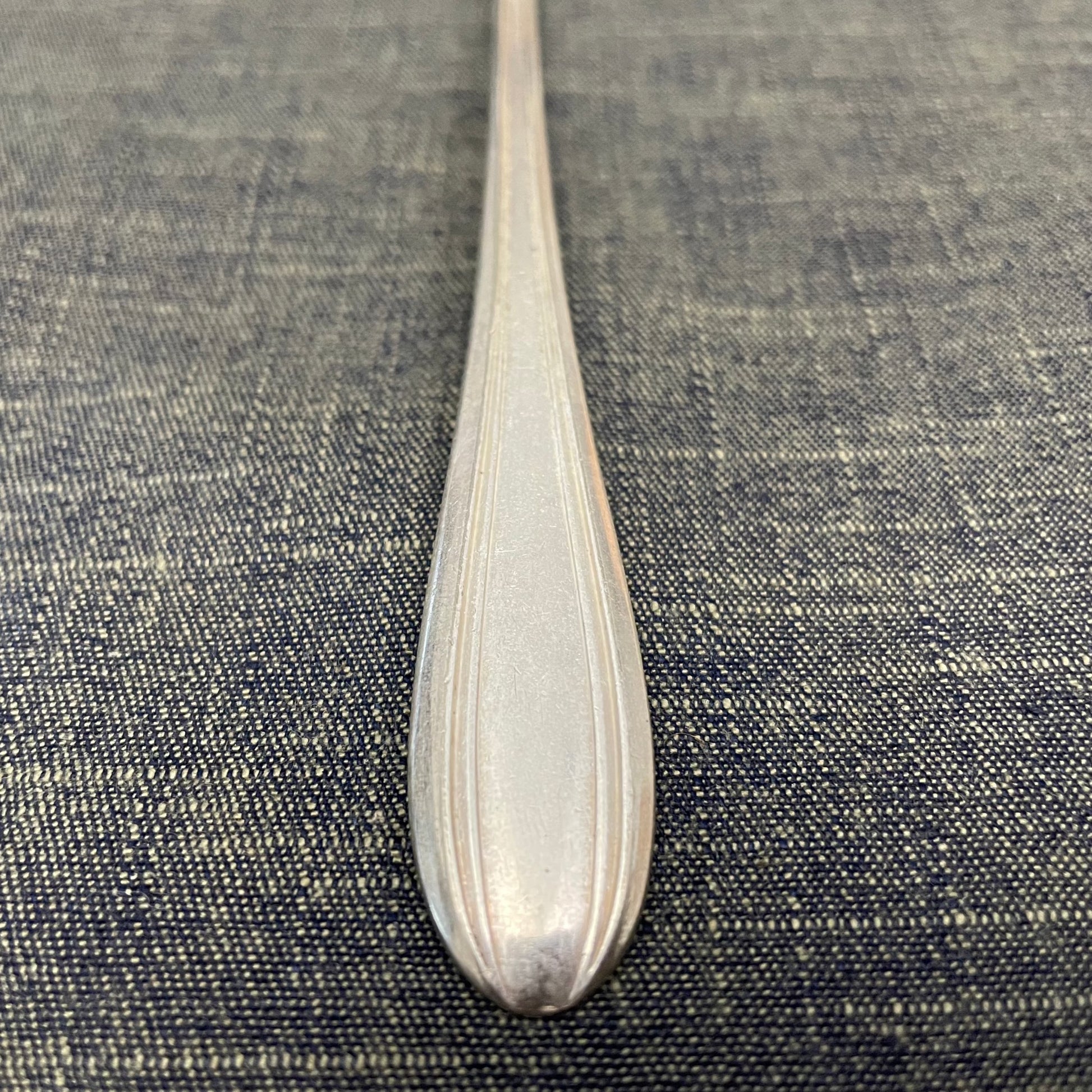 antique silver long handled teaspoon for serving jam or prop photography